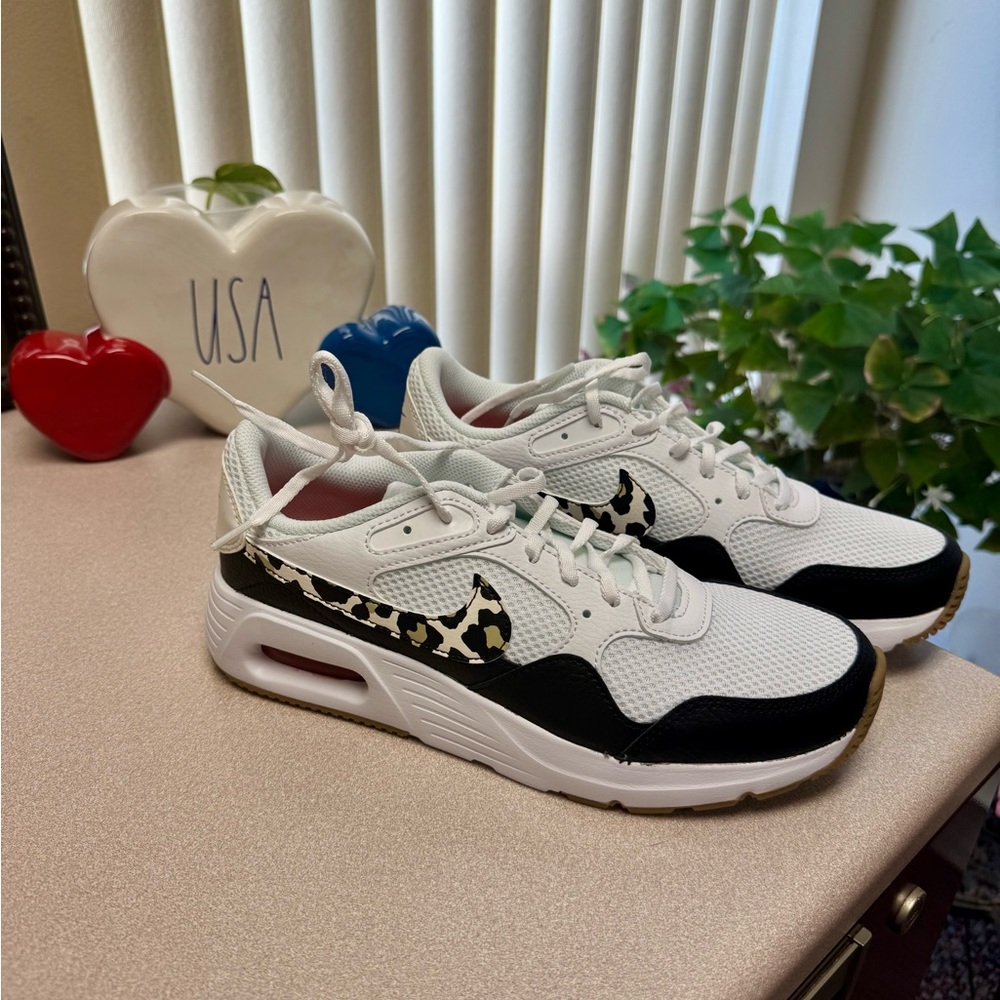 Nike Women's White and Black Sneakers with Leopard Swoosh